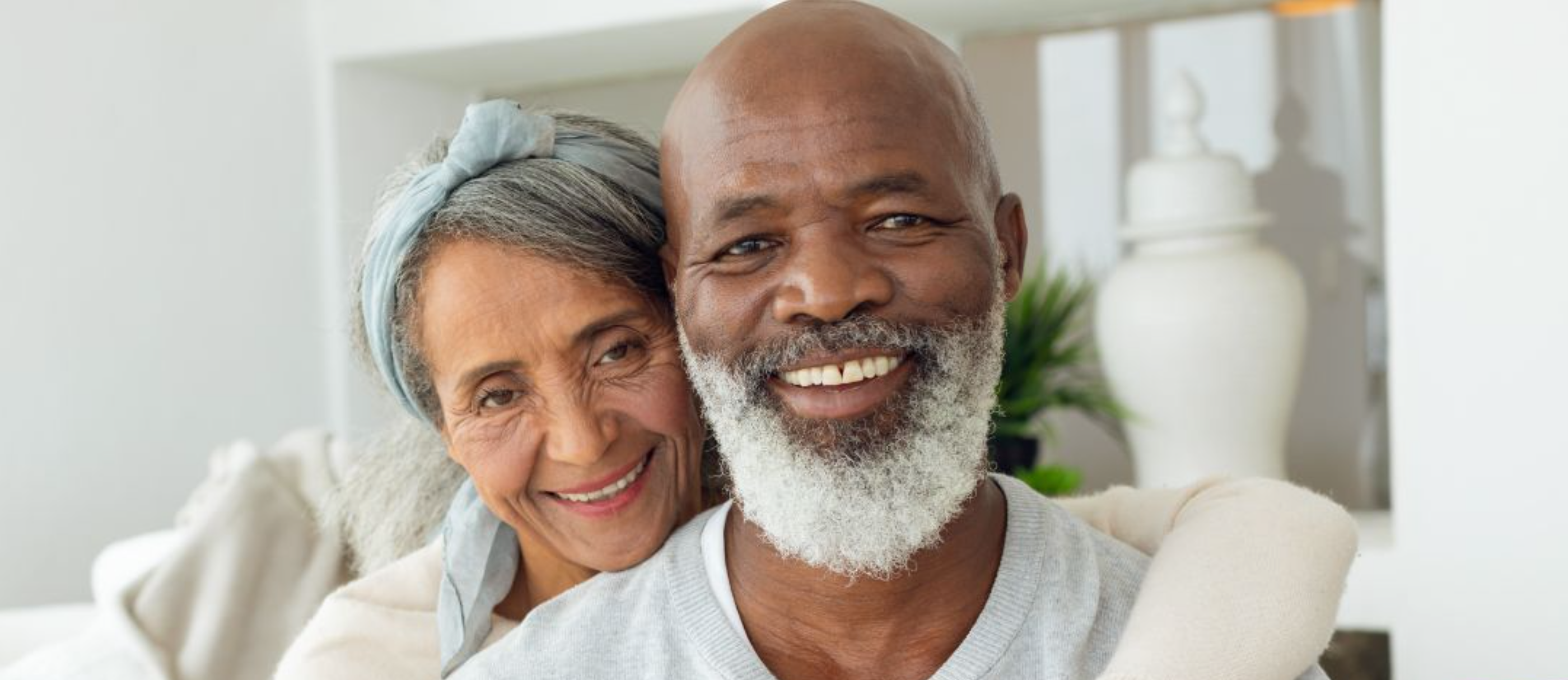 Senior couple smiling at home